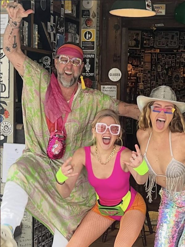 Tony and friends in fancy dress outside the joint