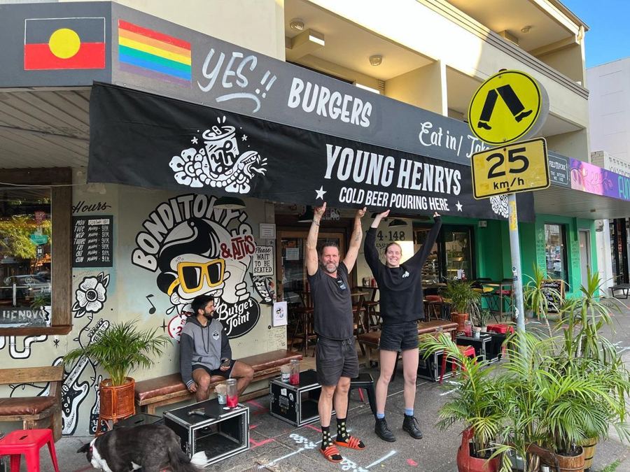 The crew holding up the Young Henrys awning outside the shopfront